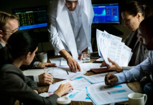 Office team discussing strategies and collaborating for clients