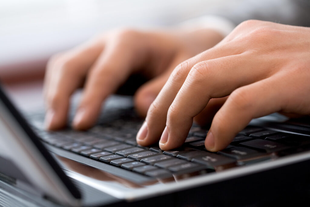 Business professional working on laptop computer